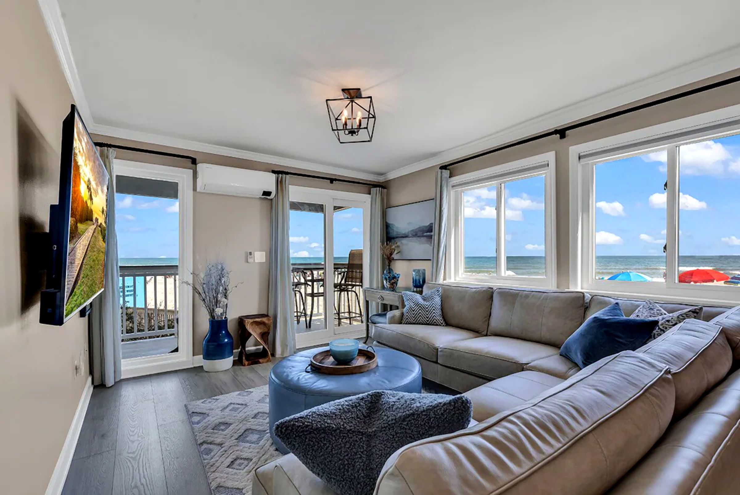 Ocean Pearl living room with oceanfront windows and balcony views
